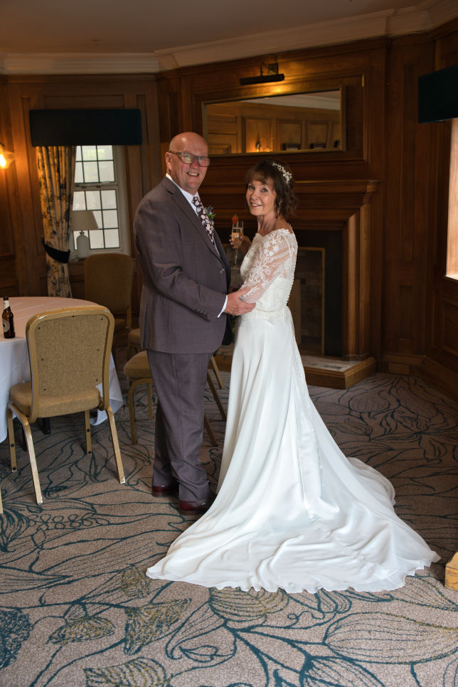 Relaxed portrait of newlyweds at The Stanneylands Hotel wedding venue